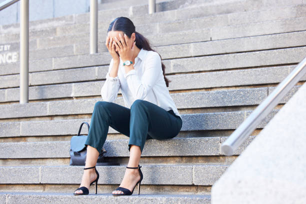 business woman on stairs, stress and burnout for work, tired and overworked. young female or entrepreneur on steps, crying and frustrated with debt, mental health and depression after fired from job - unemployment fear depression women imagens e fotografias de stock