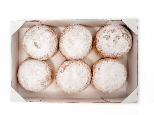 istock Freshly baked and dusted with powdered sugar German donuts. 1467036158