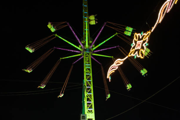 istock Spinning ride at the Feria de Malaga behind some lights 1467038005