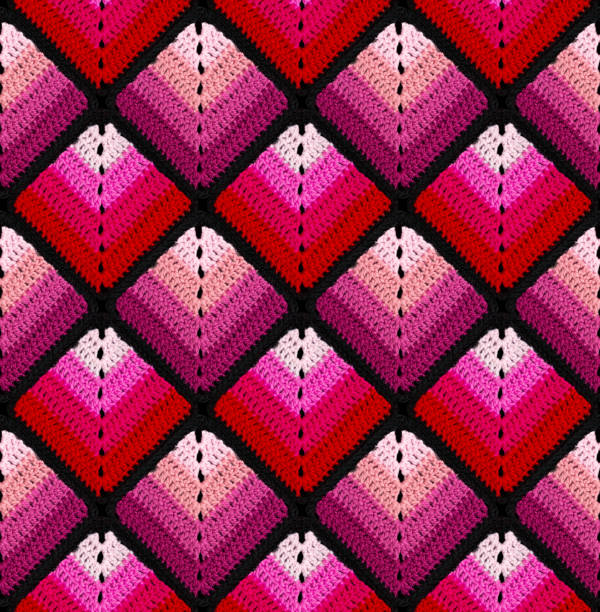 istock Seamless knitted pattern in the form of gradient rhombuses is crocheted with multi-colored threads. Patchwork style. 1467038130