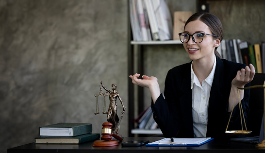 Young female Lawyer or attorney working in the office