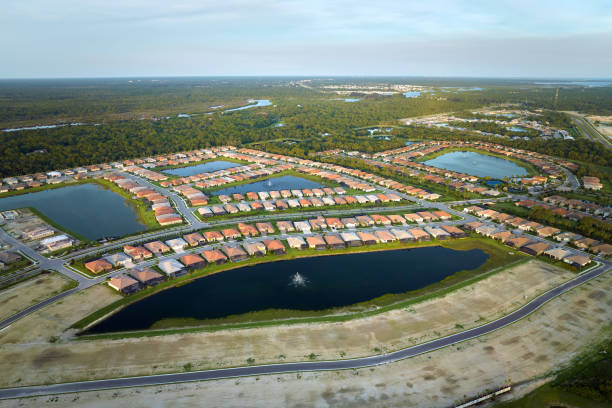 Ground prepared for building of new residential houses in Florida suburban development area. Concept of growing american suburbs Ground prepared for building of new residential houses in Florida suburban development area. Concept of growing american suburbs. basement construction site construction blueprint stock pictures, royalty-free photos & images