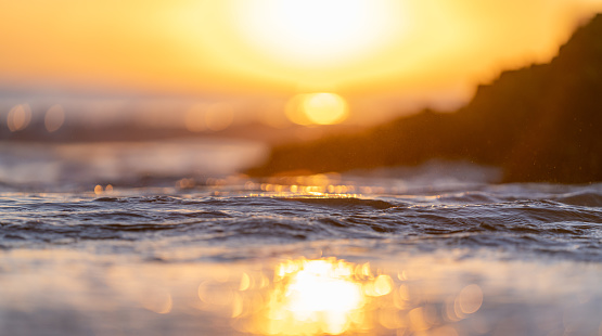 Ripples, waves and interference on calm waters at sunset of Belfast Lough, Northern Ireland.