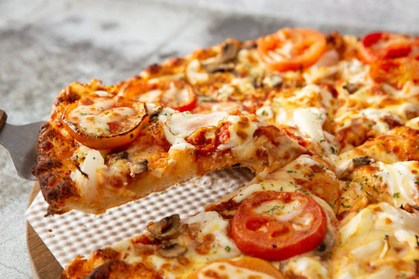 istock pizza with salami and tomatoes 1467040434