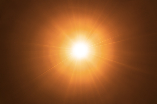 Gold exploding star sun flare background