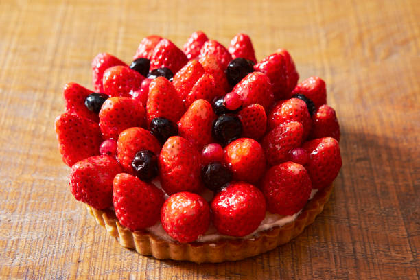 istock Strawberry blueberry cake on wooden table 1467041956