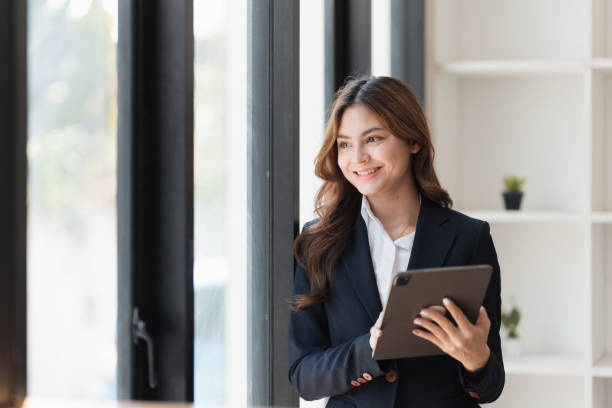 istock Smart business people working together with financial data in the digital tablet at co working space. finance and account concept. 1467044428