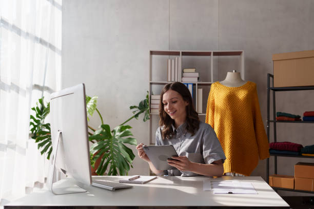 istock Beautiful young professional stylist working at design studio interior. fashion designer concept 1467045108
