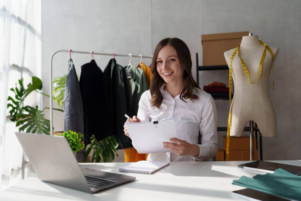 istock Beautiful young professional stylist working at design studio interior. fashion designer concept 1467046580