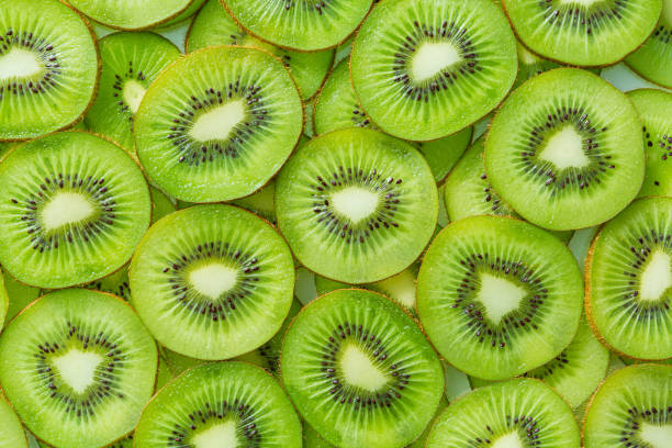 istock macro kiwi,Fresh Kiwi fruit sliced use for background,slice of kiwi fruit on a full frame. horizontal format 1467047001