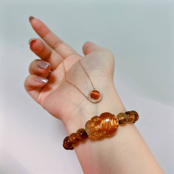 istock Copper Rutilated Quartz pendant and bracelet 1467047453