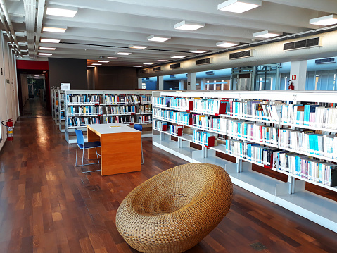 Interior of a large modern library with bookshelves.Waterloo University,Canada