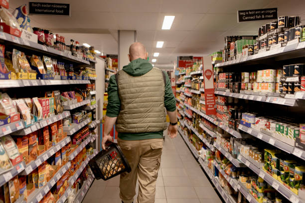 istock Man shopping in a supermarket 1467052195