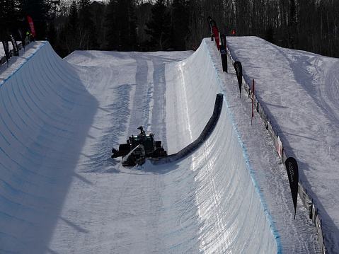 Grooming machine in the halfpipe at Buttermilk ski resort used for the Aspen X Games.