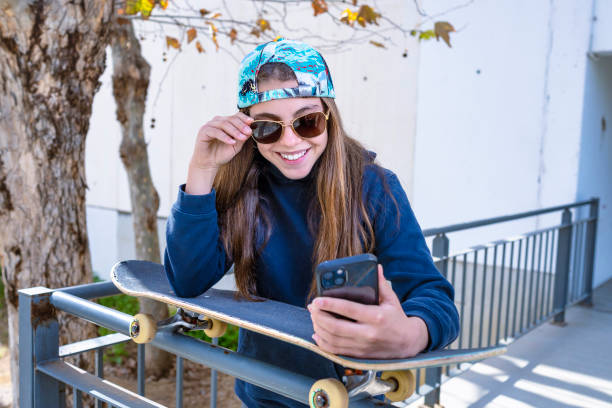 istock young girl making surf skate and smiling 1467054394
