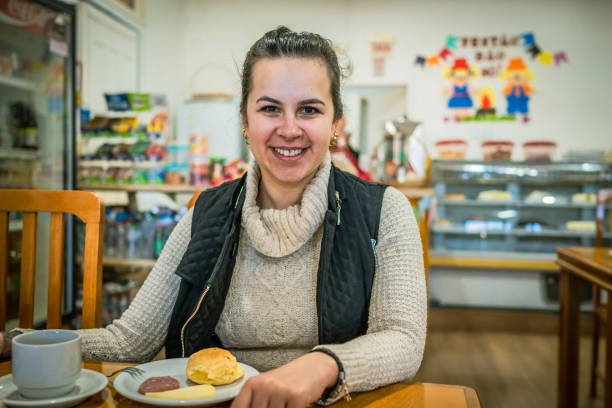 istock woman in restaurant looking and smi 1467054505
