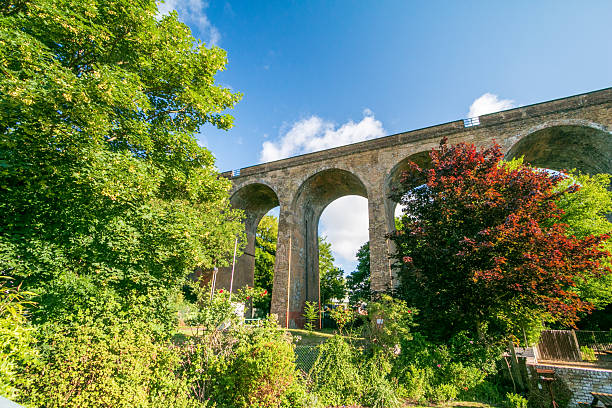 The large aqueduct-like structure at South Darenth is the South Darenth railway viaduct, a Victorian brick viaduct built in 1859–60 for the London, Chatham & Dover Railway. It carries the railway high across the Darent valley, spanning the River Darent, roads and floodplain on a series of tall brick arches. Although it resembles a canal aqueduct, it was built solely to carry trains, not water, and is a typical example of mid-19th-century railway engineering.