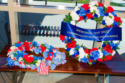 Cape Canaveral, FL, USA, May 30, 2022: Flower Wreaths displayed in the US. Memorial Day in Cape Canaveral National Cemetery.
