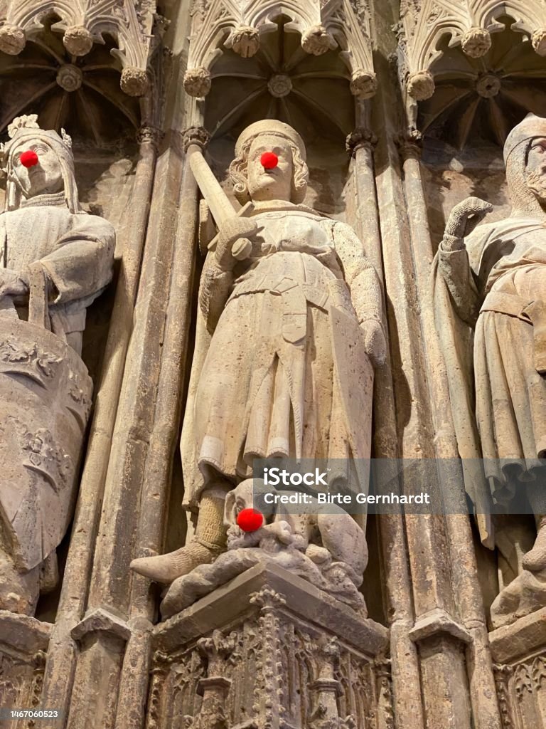 Ancient statues with red carnival noses Altstadt - Cologne Stock Photo