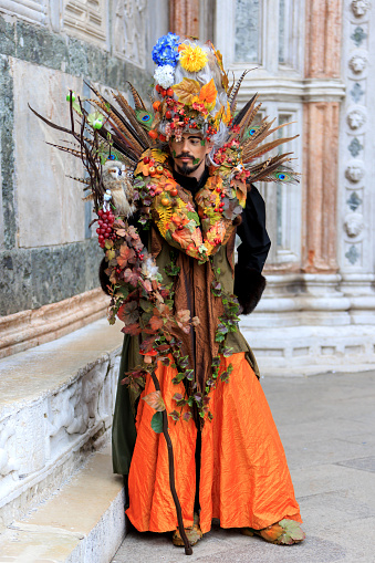 Venice, Italy, February 05th, 2023: A man in a traditional costume during the Venice Carnival The Carnival of Venice (Carnevale di Venezia) is an annual festival, held in Venice, Italy and is now established as one of the world s most colourful must-see events.The central feature of the carnival are the masks.The maks and costumes are decorated with complex designs making them stand out.During the Carnival the people are allowed to wear masks to conceal their identity from others while conversing.