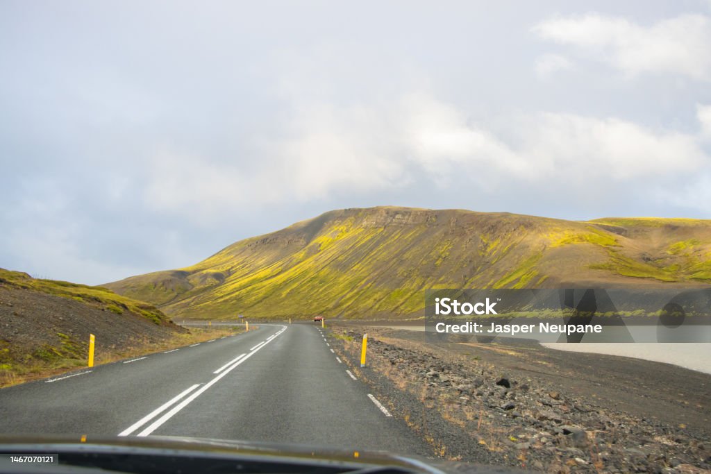 Beautiful Reflection of Houses, Church, Highway and Rainbow Road in Seydisfjordur Town in Iceland Awe Stock Photo