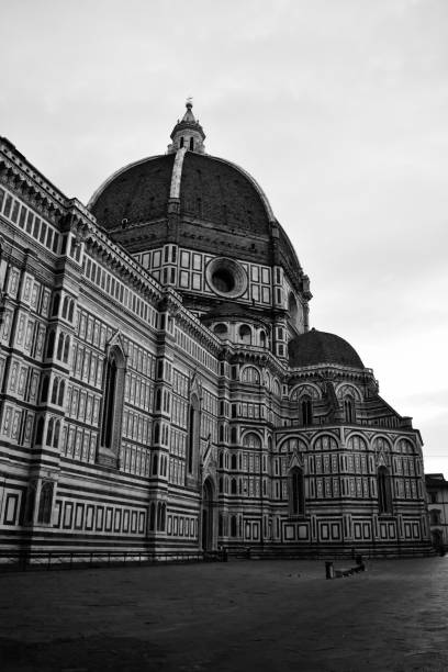 Florence Cathedral with one person sitting on a bench