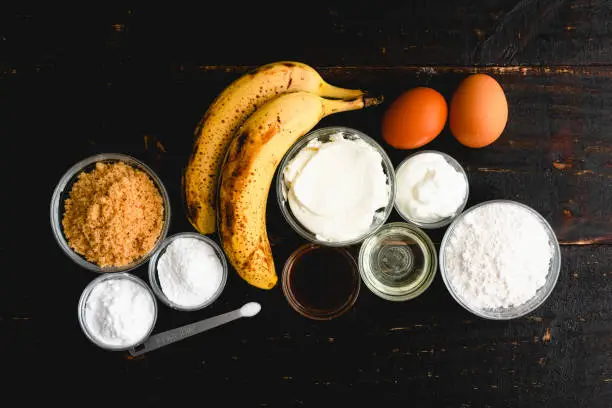 Ripe bananas, flour, brown sugar, and other raw ingredients