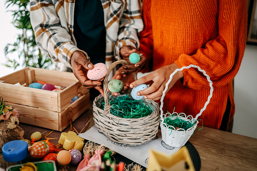 Mother and daughter are preparing decorations for Easter