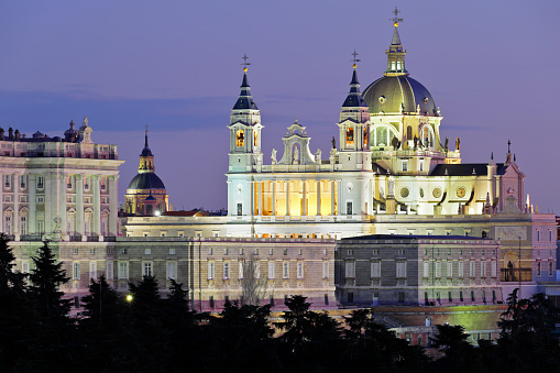 nighttime view of the Madrid skyline featuring the Almudena cathedral (Spain).