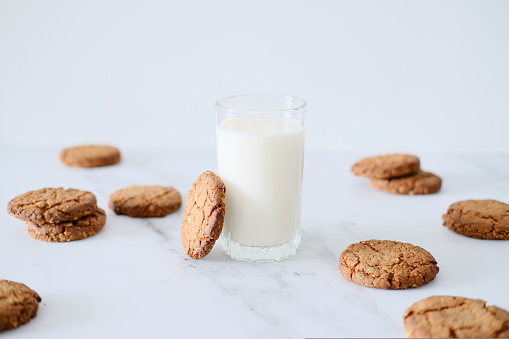 Oatmeal cookies with milk. Healthy food for breakfast or a snack. Side view.