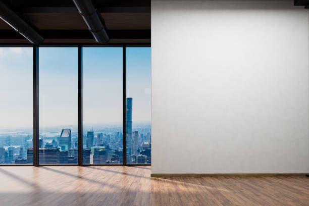 istock large office with blank white wall and copy space in front of panoramic window skyline view, wooden parquet floor; 3D Illustration 1467081167