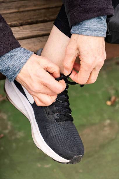istock Tying Shoe Preparing to Play Pickleball 1467084944