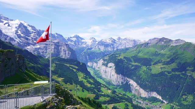 Swiss flag in Bernese Oberland, one of Switzerland most popular destinations for tourists.