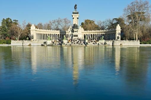daytime view of El Retiro park and The monument to king Alfonso XII - c.1902 (Madrid, Spain).