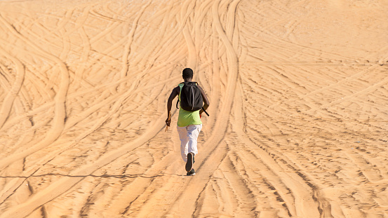 Sporty man training in the desert, photo