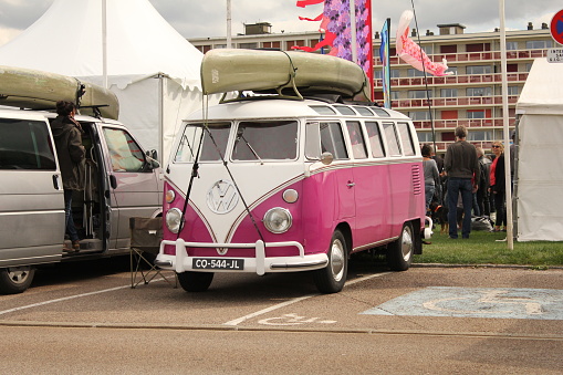 Dieppe, France - sep 8, 2018: a pink volkswagen van at a parking at the french coast