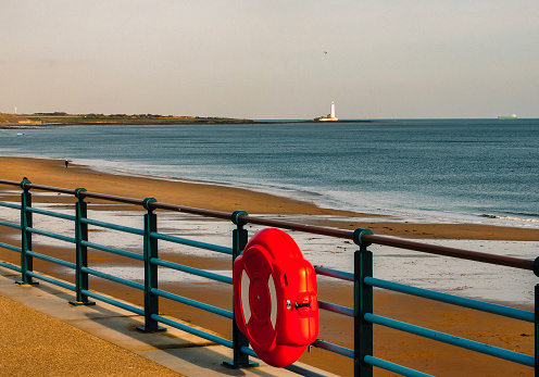 Life preserver on the railings at Whitley Bay beach