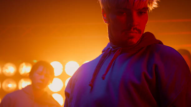istock Dancer guy making rhythmic movements with friends in nightclub. Group performing 1467100594