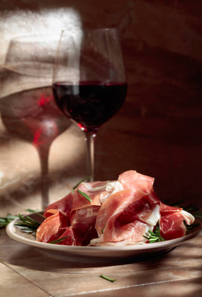 istock Prosciutto or Spanish jamon with rosemary and red wine. 1467102879