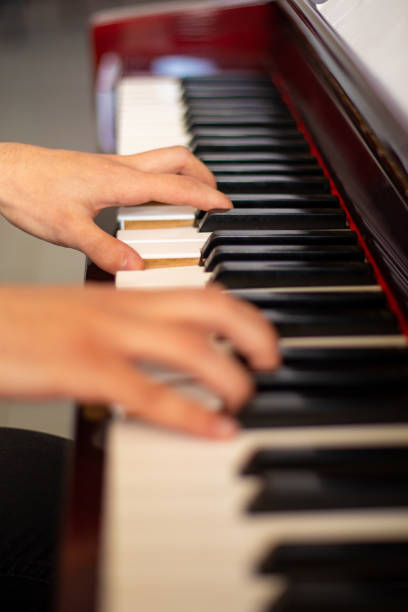 istock person playing the piano 1467103109