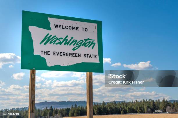 A Roadside Welcome To Washington The Evergreen State Sign In The Rural Area Near Spokane Washington Usa Coming From The State Of Idaho Stock Photo - Download Image Now
