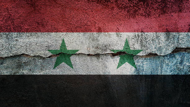 istock Syria flag on cracked wall. Earthquake or drought concept 1467108557