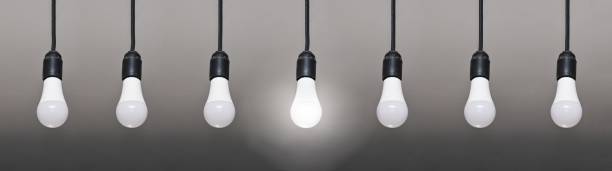 istock seven LED lamps on wires, only one lamp is lit. 1467108766