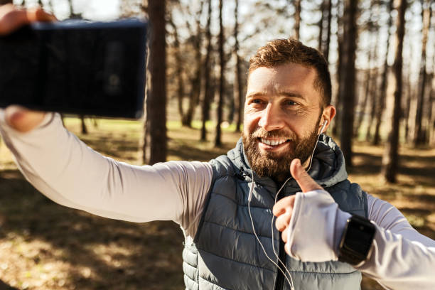 istock Young runner man making selfie holding thumbs up 1467108811