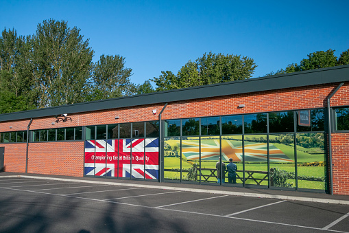 Aldi Supermarket on Otford Road in Sevenoaks at Kent, England, with a banner saying it champions British quality.