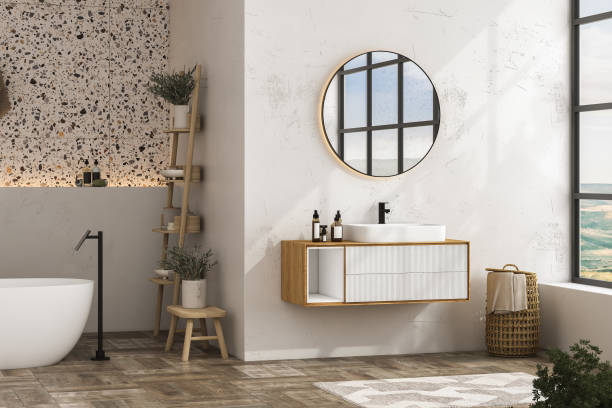 istock Modern minimalist bathroom interior, modern bathroom cabinet, white sink, wooden vanity, interior plants, bathroom accessories, bathtub, white wall, terrazzo flooring. 3d rendering 1467113703