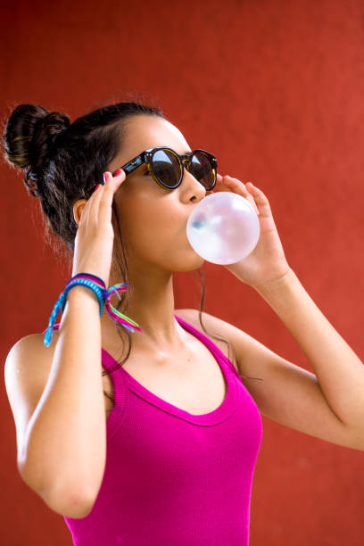 istock young girl making bubble gum 1467114562