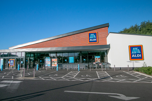 Reading, UK: February 24, 2018: Reading Motorway Services is a three burger rated service area on the M4 operated by Moto. Panoramic with blue sky background.