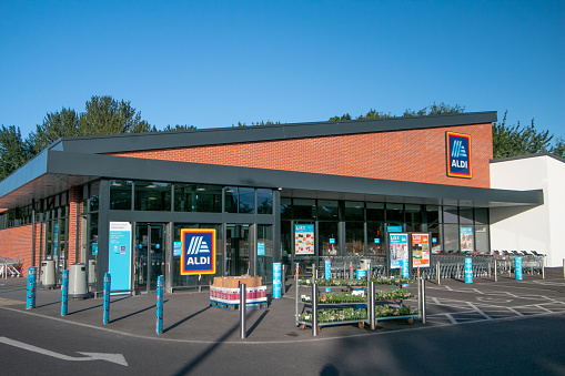 Aldi Supermarket on Otford Road in Sevenoaks at Kent, England, with commercial signs visible.