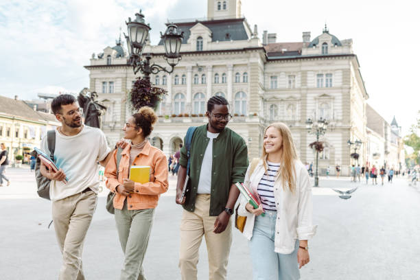 Cheerful Multi-ethnic group of students on the street stock photo